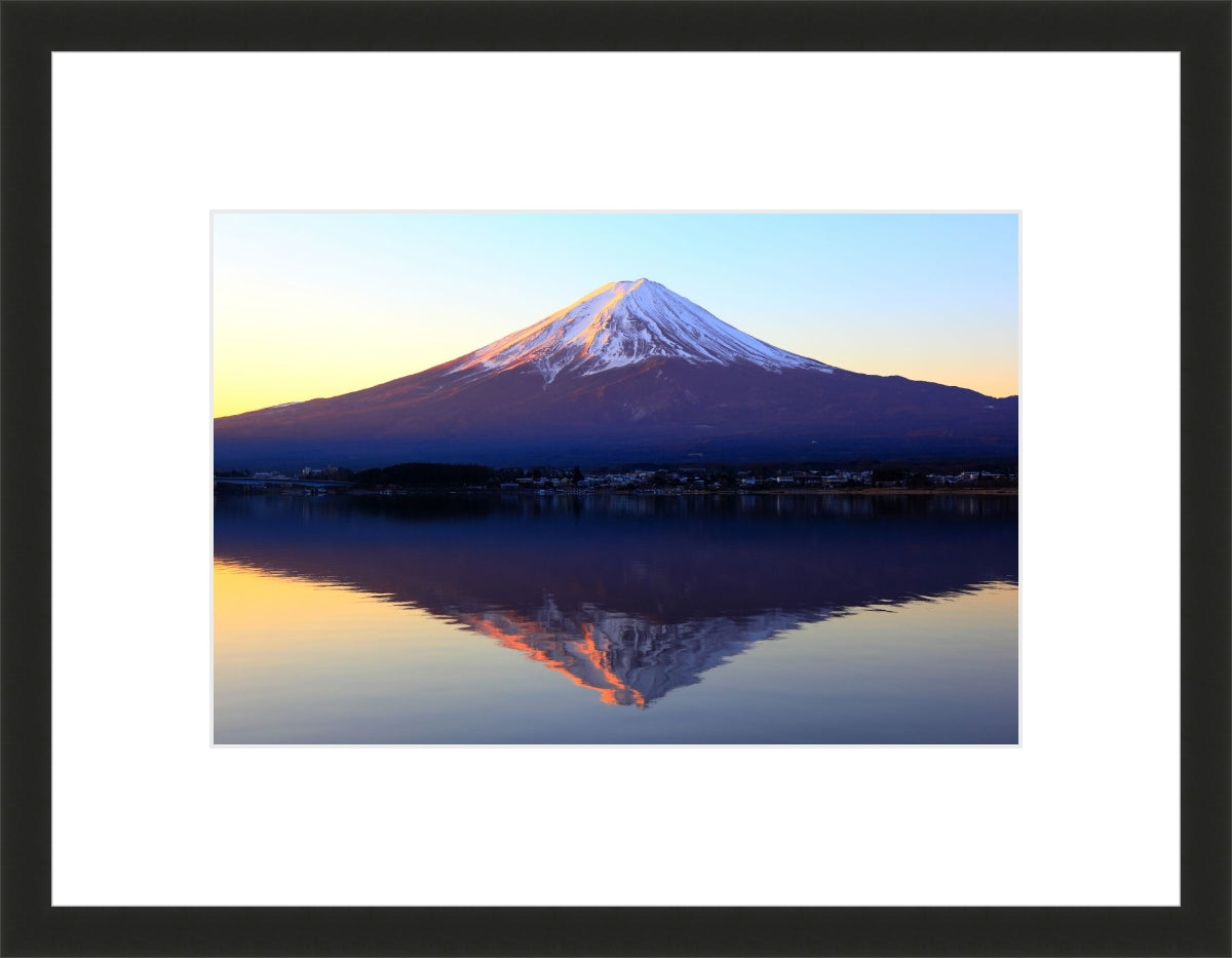 The reddish mountain Fuji and reflection