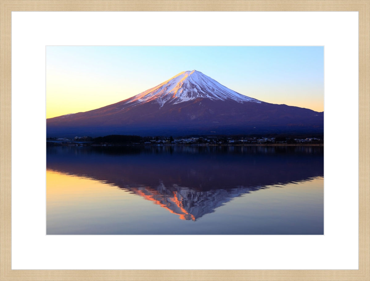 The reddish mountain Fuji and reflection