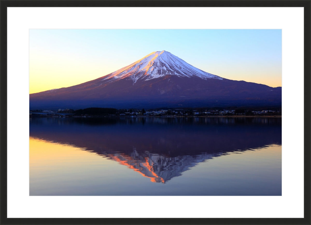 The reddish mountain Fuji and reflection